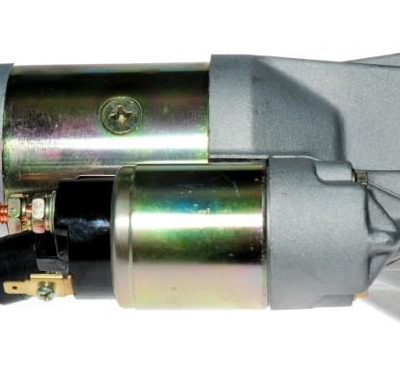 Automotive starter motor with solenoid and mounting flange, used to start an engine